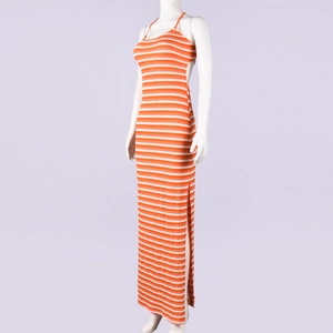 Detail view of the orange and white striped knit dress with backless cut and side slit