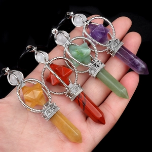 Handheld Merkaba hexagonal crystal pendant necklace set with intricate silver patterns