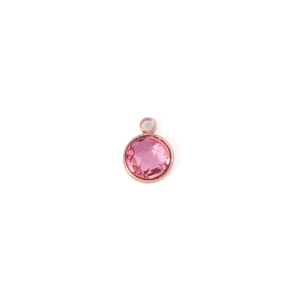 Detailed view of a 7mm round pink birthstone pendant with rose gold plated metal frame