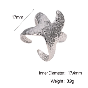 Detailed close-up of a silver starfish open ring with unique textured metal surface