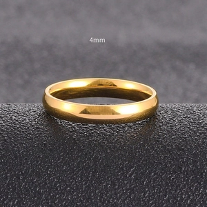 Close-up of 4mm gold-plated titanium steel ring with high polished mirror finish