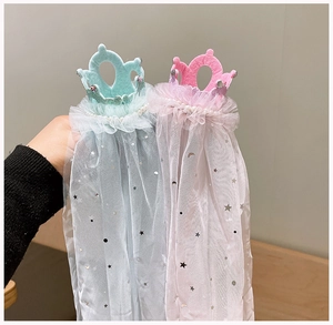 Detail of girls' tiara headbands with sequined tulle veils in pink and cyan colors