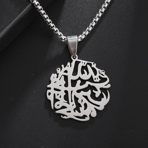 Detailed close-up of a silver stainless steel necklace with Arabic calligraphy pendant