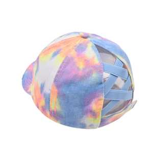 Detail view of tie-dye ponytail baseball cap featuring unique criss-cross elastic bands