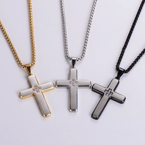 Three rhinestone cross pendant necklaces in gold, silver, and black stainless steel