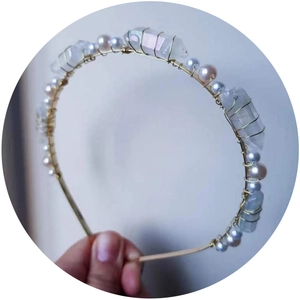 Handmade gold metal headband featuring white pearls and natural quartz crystal stones