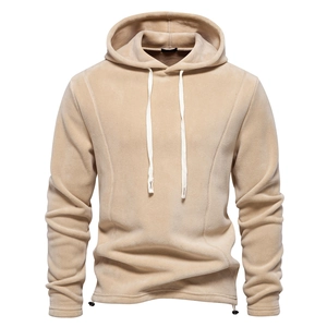 Close-up of warm khaki fleece texture and white drawstring on men hooded sweatshirt