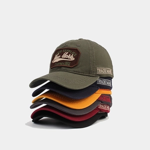 Vintage embroidered baseball caps in multiple colors including olive and navy blue