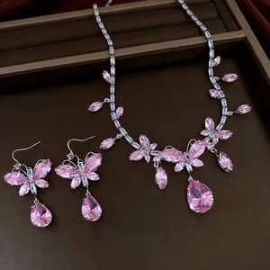 Elegant pink crystal butterfly necklace and earrings set with teardrop pendants