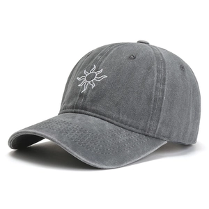 Washed grey cotton baseball cap with white sun embroidery and curved brim in 45-degree view