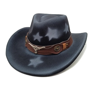 Close-up of bronze bull head emblem and star pattern on vintage felt cowboy hat