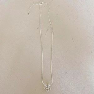 Macro detail of S925 sterling silver daisy pendant and snake bone chain structure