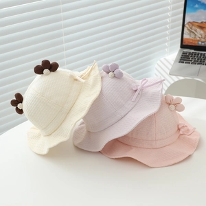 Infant waffle knit sun hats with floral details and ribbons in assorted pastel colors