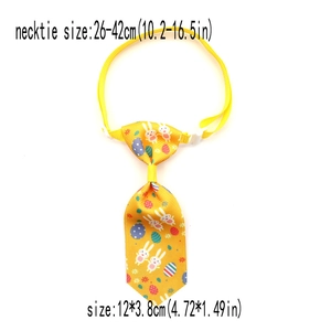Detail of Easter pet necktie with rabbit and egg patterns and adjustable buckle