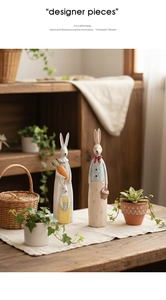 Detail of vintage wooden-style resin rabbit figurines for rustic home decor and gifting