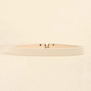Detail of beige elastic waist belt featuring a gold metal buckle and leather accents