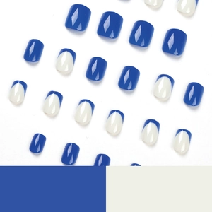 Short square press-on nails set featuring dark blue solid color and French tip designs