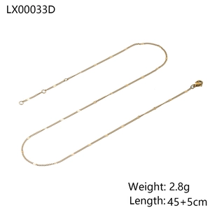 Detail of gold snake chain necklace with round metal discs and adjustable lobster clasp
