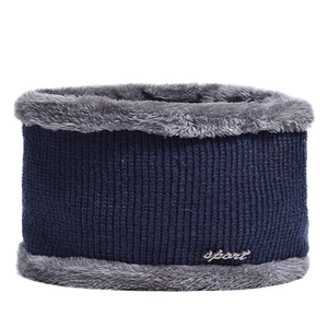 Close-up of navy blue knit neck warmer with grey plush fleece lining and sport metal tag
