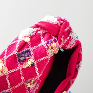 Fashionable rose red knotted headband with sparkling sequins and fabric texture