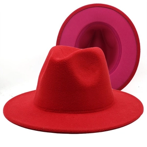 Two-tone wide brim wool fedora hat featuring red exterior and vibrant pink lining