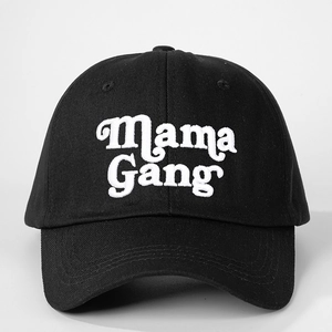 Detailed view of white Mama Gang embroidery on a black six-panel baseball cap