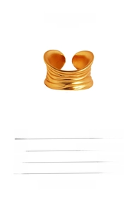 Detailed view of wide gold-plated wavy ring with matte texture and adjustable opening band