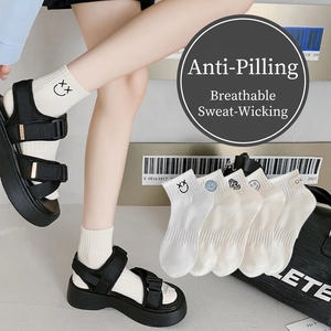 White ribbed cotton ankle socks for women featuring embroidered cartoon smiley faces