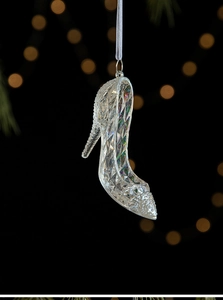 Detail of crystal high heel ornament with sparkling rhinestones and silver ribbon
