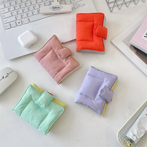 Quilted fabric binder notebooks in vibrant orange, pink, lavender, and mint green colors