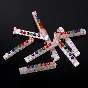 Handmade selenite wand pendant with copper wire wrapping and seven chakra stones