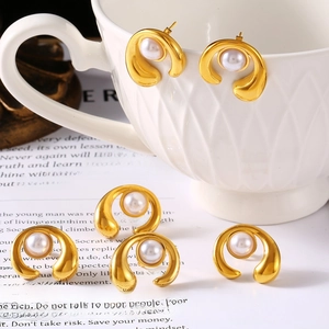Elegant C-shaped titanium steel gold-plated earrings with inlaid white shell pearls
