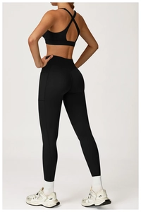 Detail of high-waist yoga leggings with a side pocket and moisture-wicking fabric