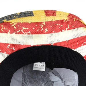 Detail of western straw hat showing 100% paper material label and USA flag pattern