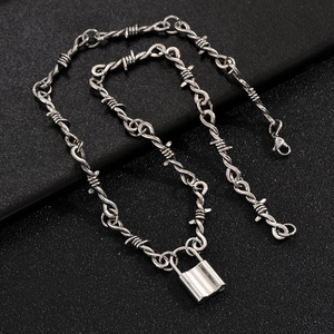Gothic thorn wire chain necklace with a heart-shaped padlock pendant in silver finish
