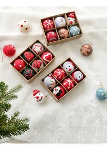 Macro shot of assorted Christmas felt ornaments in a kraft paper gift box