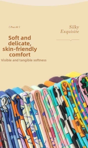 Detailed close-up of vibrant jacquard knit cotton socks with creative asymmetric patterns