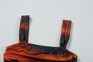Detail of ombre two-piece set featuring gradient fabric and ruched shoulder strap design