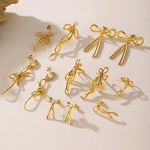 Elegant 18K gold plated stainless steel bow and tassel earrings with zircon details