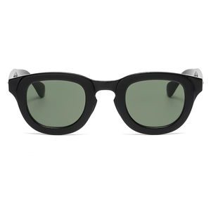 Modern cat-eye sunglasses featuring a thick black frame and dark green lenses in front view
