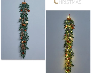 Detailed view of Christmas teardrop swag with LED lights, golden baubles and pine cones