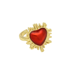 Detailed close-up of 18k gold heart ring with red stone and sunburst radiant design