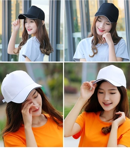 Close-up of black and white baseball caps worn by female models in daily life