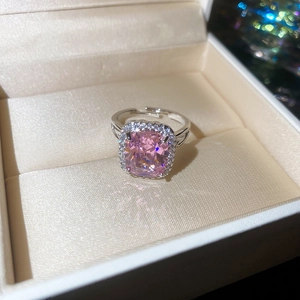 Close-up of pink rectangular zircon ring with silver multi-layer adjustable band