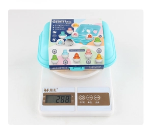 Dinosaur color matching eggs toy set in blue tray showing total weight of 288g