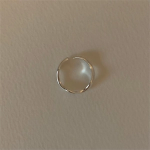 Minimalist S925 sterling silver open ring with thin band design on textured background