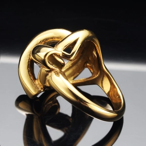 Minimalist gold stainless steel ring with hollow knot design and polished finish