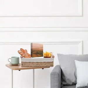 Rectangular paper rope woven storage basket with handle and beige linen lining on a table
