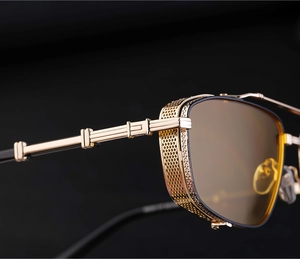Macro detail of steampunk sunglasses featuring golden mesh side shields and metal frame