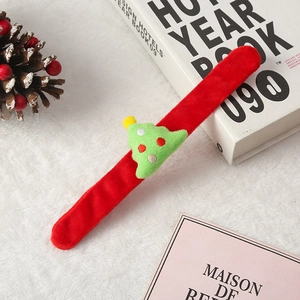Plush Christmas slap bracelet featuring a green tree design on a red furry band